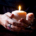 female hands holding a burning candle